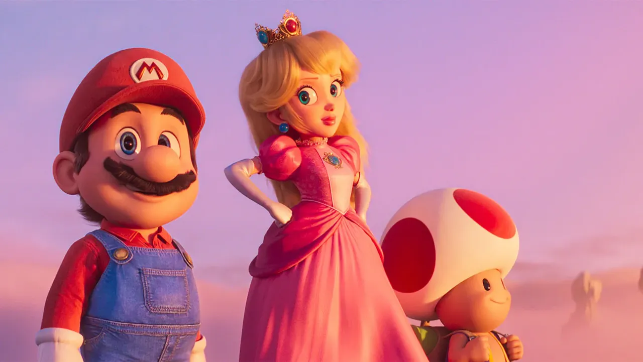 2530_T2_00070-H-2023 Mario, Peach und Toad stehen vor einem Sonnenuntergang. Mario guckt zufrieden nach vorne, Peach schaut ihn an. - Foto: Universal Pictures