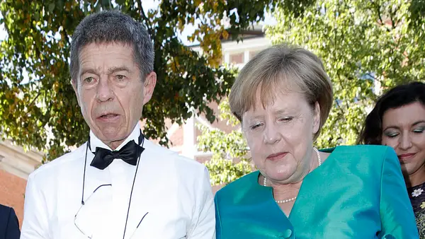 Joachim Sauer und Angela Merkel