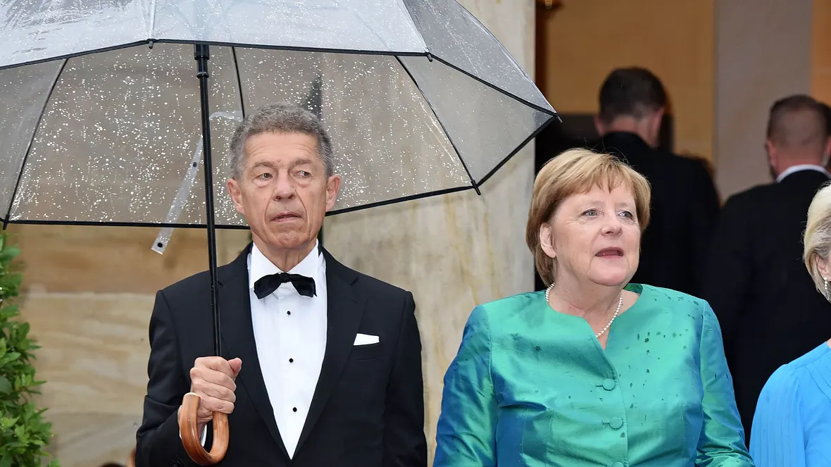 Joachim Sauer und Angela Merkel