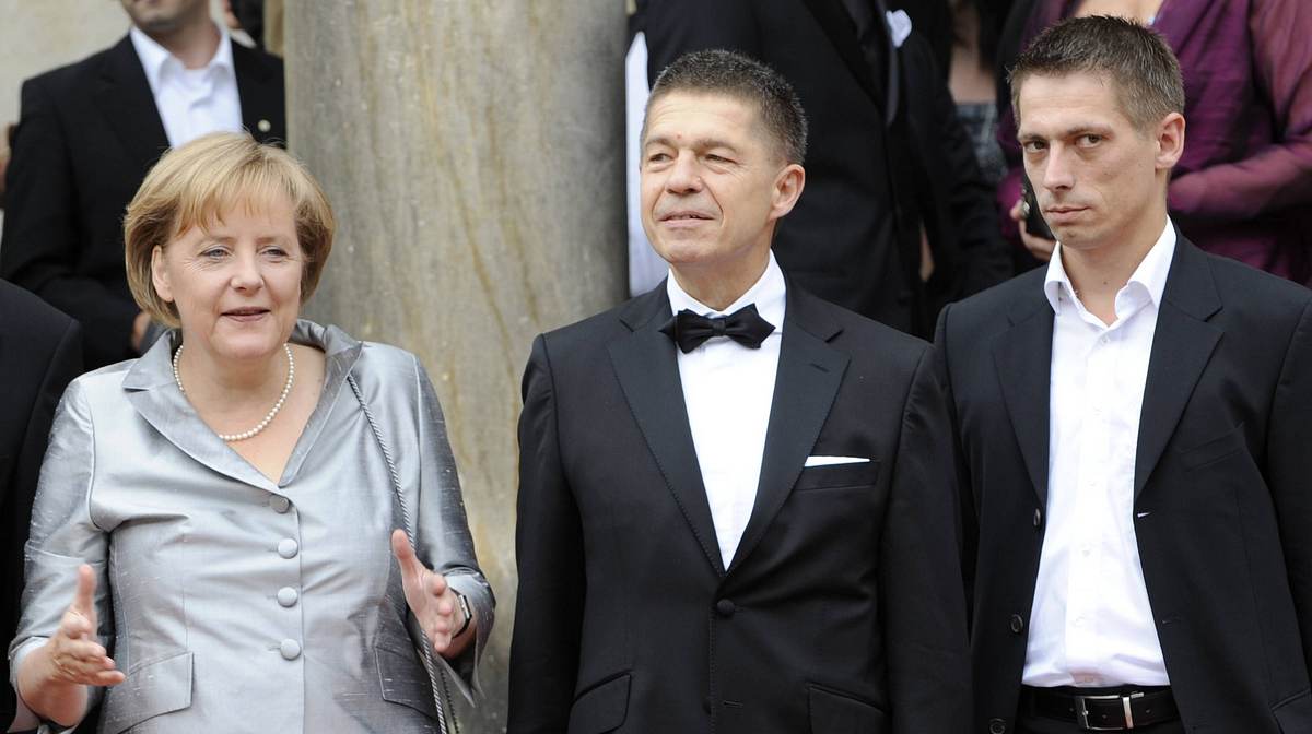 Angela Merkel mit Joachim Sauer und Sohn Daniel 