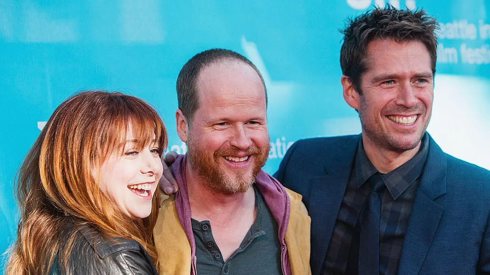 Alyson Hannigan mit ihrem Ehemann und dem Alyson Hannigan mit ihrem Ehemann und dem