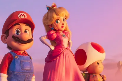 Mario, Peach und Toad stehen vor einem Sonnenuntergang. Mario guckt zufrieden nach vorne, Peach schaut ihn an. 